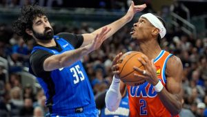 Oklahoma City Thunder guard Shai Gilgeous-Alexander (2) looks for an open shot as Orlando Magic centre Goga Bitadze (35) defends during the second half of an NBA basketball game, Thursday, Dec. 19, 2024, in Orlando, Fla. (John Raoux/AP)