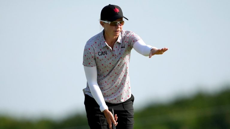 Alena Sharp, of Canada, watches her putt during a practice round for the women's golf event at the 2024 Summer Olympics, Tuesday, Aug. 6, 2024, at Le Golf National in Saint-Quentin-en-Yvelines, France. (Matt York/AP Photo)