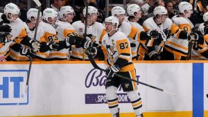 Pittsburgh Penguins centre Sidney Crosby (87) celebrates his goal with teammates during the second period of an NHL hockey game against the Nashville Predators, Thursday, Dec. 19, 2024, in Nashville, Tenn. (George Walker IV/AP)