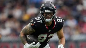 Houston Texans tight end Cade Stover runs the ball during an NFL football game against the Tennessee Titans Tuesday, Nov. 26, 2024, in Houston. (Ashley Landis/AP)