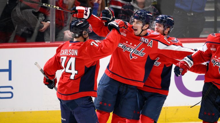 Washington Capitals centre Dylan Strome (17) celebrates after his goal with defenceman John Carlson (74) and others during the third period of an NHL hockey game against the Buffalo Sabres, Saturday, Dec. 14, 2024, in Washington. (Nick Wass/AP)