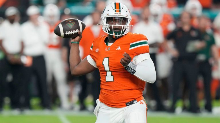 Miami quarterback Cam Ward (1) aims a pass during the first half of an NCAA college football game against Virginia Tech , Friday, Sept. 27, 2024, in Miami Gardens, Fla. (Marta Lavandier/AP)