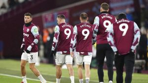 West Ham United players wear the shirt of team-mate Michail Antonio before the English Premier League soccer match between West Ham and Wolverhampton at the London Stadium. (Zac Goodwin/AP)
