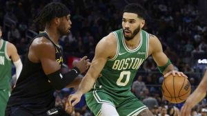 Boston Celtics forward Jayson Tatum (0) drives to the basket against Golden State Warriors guard Buddy Hield, left, during the first half of an NBA basketball game in San Francisco, Monday, Jan. 20, 2025. (Jed Jacobsohn/AP)