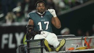 Philadelphia Eagles linebacker Nakobe Dean gestures as he is carted away after an injury during the first half of an NFL wild-card playoff football game against the Green Bay Packers on Sunday, Jan. 12, 2025, in Philadelphia. (Matt Slocum/AP)