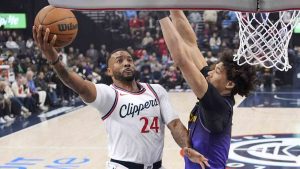 Los Angeles Clippers guard Norman Powell, left, shoots as Los Angeles Lakers center Jaxson Hayes defends during the first half of an NBA basketball game, Sunday, Jan. 19, 2025, in Inglewood, Calif. (Mark J. Terrill/AP)