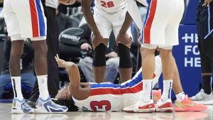 Teammates look over Detroit Pistons guard Jaden Ivey (23) after an incident during the second half of an NBA basketball game against the Orlando Magic, Wednesday, Jan. 1, 2025, in Detroit. (Carlos Osorio/AP)