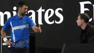 Novak Djokovic, left, of Serbia talks with his coach Andy Murray during his first round match against Nishesh Basavareddy of the U.S. at the Australian Open tennis championship in Melbourne, Australia, Monday, Jan. 13, 2025. (AP Photo/Asanka Brendon Ratnayake)