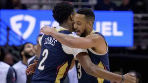 New Orleans Pelicans guard CJ McCollum (3) celebrates a 3-point basket with forward Herbert Jones (2) during the first half of an NBA basketball game against the Washington Wizards in New Orleans, Friday, Jan. 3, 2025. (Matthew Hinton/AP)