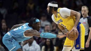 Charlotte Hornets centre Mark Williams (5) guards against Los Angeles Lakers forward Anthony Davis (3) during the first half of an NBA basketball game Monday, Jan. 27, 2025, in Charlotte, N.C. (Jacob Kupferman/AP)