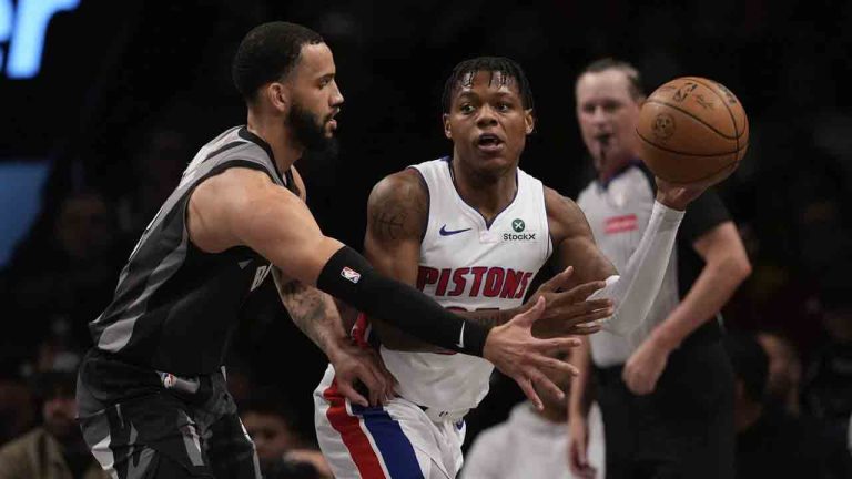 Detroit Pistons' Marcus Sasser (25) passes away from Brooklyn Nets' Tyrese Martin (13) during the first half of an NBA basketball game, Wednesday, Jan. 8, 2025, in New York. (Frank Franklin II/AP)