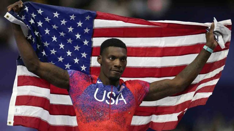 Fred Kerley, of the United States, poses after winning the bronze medal in the men's 100 meters final at the 2024 Summer Olympics, Sunday, Aug. 4, 2024, in Saint-Denis, France. (Ashley Landis/AP)