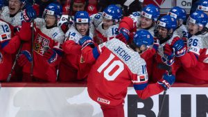 Czechia forward Adam Jecho (10) skates past the bench to celebrate his game-winning goal with teammates during third period IIHF World Junior Hockey Championship quarterfinal action against Canada, in Ottawa, Thursday, Jan. 2, 2025. (Adrian Wyld/CP)