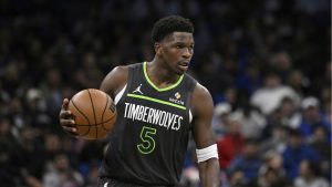 Minnesota Timberwolves guard Anthony Edwards (5) brings the ball up the court against the Orlando Magic during the first half of an NBA basketball game, Thursday, Jan. 9, 2025, in Orlando, Fla. (Phelan M. Ebenhack/AP)