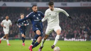 Arsenal's Kai Havertz, right, challenges for the ball with Manchester United's Mason Mount during the English FA Cup soccer match between Arsenal and Manchester United at the Emirates stadium in London, Sunday, Jan. 12, 2025. (Kin Cheung/AP)