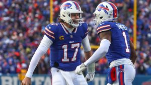 Buffalo Bills quarterback Josh Allen (17) celebrates with wide receiver Curtis Samuel (1) after Samuel scored a touchdown against the Denver Broncos during the fourth quarter of an NFL wild card playoff football game, Sunday, Jan. 12, 2025, in Orchard Park, N.Y. (AP Photo/Jeffrey T. Barnes)