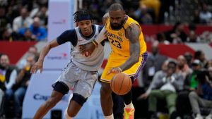 Washington Wizards guard Bilal Coulibaly (0) defends as Los Angeles Lakers forward LeBron James (23) recovers the ball during the first half of an NBA basketball game Thursday, Jan. 30, 2025, in Washington. (Jess Rapfogel/AP)