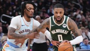 Milwaukee Bucks' Damian Lillard gets past San Antonio Spurs' Stephon Castle during the first half of an NBA basketball game Wednesday, Jan. 8, 2025, in Milwaukee. (Morry Gash/AP)