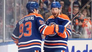 Edmonton Oilers' Ryan Nugent-Hopkins (93) and Connor Brown (28) celebrate a goal against the Florida Panthers during second period NHL action in Edmonton on Monday, December 16, 2024. (Jason Franson/CP)