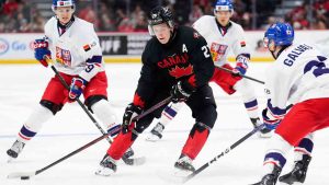 Canada's Calum Ritchie (21) moves the puck around Czechia's Tomas Galvas (23) during second period World Junior Championship hockey pre-tournament action in Ottawa, Monday, Dec. 23, 2024. (Sean Kilpatrick/CP)