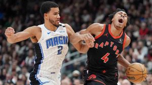 Toronto Raptors forward Scottie Barnes (4) is fouled by Orlando Magic guard Caleb Houstan (2) during first half NBA basketball action in Toronto on Friday, Jan. 3, 2025. (Frank Gunn/CP)