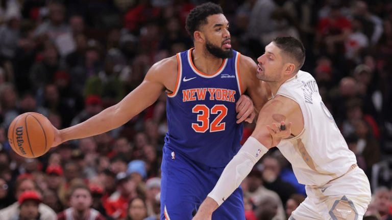 Chicago Bulls center Nikola Vucevic, left, posts up against New York Knicks center Karl-Anthony Towns (32), right, during the second half of an NBA basketball game, Saturday, Jan. 4, 2025, in Chicago. (AP Photo/Melissa Tamez)