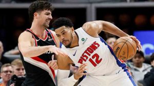 Detroit Pistons forward Tobias Harris (12) drives against Portland Trail Blazers forward Deni Avdija (8) during the second half of an NBA basketball game Monday, Jan. 6, 2025, in Detroit. (Duane Burleson/AP)