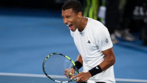 Felix Auger-Aliassime of Canada reacts after defeating Sebastian Korda of the U.S. in the men's final of the Adelaide International at Memorial Drive Tennis Club in Adelaide, Australia, Saturday, Jan. 11, 2025. (Matt Turner/AAP Image via AP)