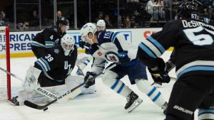 Winnipeg Jets center Rasmus Kupari (15) moves the puck to the goal against Utah Hockey Club goaltender Connor Ingram (39) during the second period of an NHL hockey game Monday, Jan. 20, 2025, in Salt Lake City. (Melissa Majchrzak/AP)