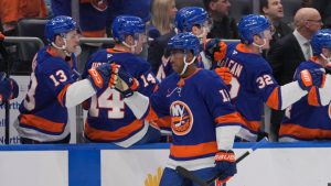 New York Islanders' Anthony Duclair (11) celebrates with teammates after scoring a goal during the first period of an NHL game against the Philadelphia Flyers, Friday, Jan. 24, 2025. (AP Photo/Frank Franklin II)