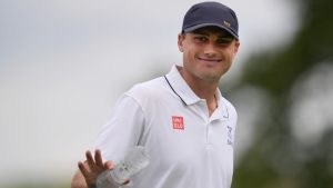 Ludvig Aberg waves to fans as he walks along the fairway during the third round of the men's golf event at the 2024 Summer Olympics, Saturday, Aug. 3, 2024, in Saint-Quentin-en-Yvelines, France. (AP Photo/George Walker IV)