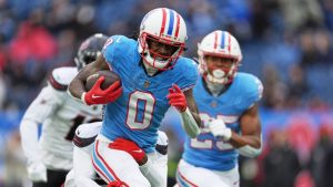 Tennessee Titans wide receiver Calvin Ridley (0) is tackled by Houston Texans safety Calen Bullock after catching a pass during the first half of an NFL football game Sunday, Jan. 5, 2025, in Nashville, Tenn. (George Walker IV/AP)