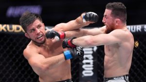 Merab Dvalishvili, right, connects with Henry Cejudo during their bantamweight bout at the UFC 298 mixed martial arts event Saturday, Feb. 17, 2024, in Anaheim, Calif. (Mark J. Terrill/AP)