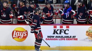 Winnipeg Jets' Kyle Connor (81) celebrates his third goal of the period against the Vancouver Canucks with teammates during the first period of their NHL hockey game in Winnipeg, Tuesday January 14, 2025. (Fred Greenslade/CP)