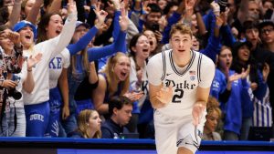 Duke's Cooper Flagg (2) reacts after hitting a 3-pointer during the first half of an NCAA college basketball game against Notre Dame in Durham, N.C., Saturday, Jan. 11, 2025. (AP Photo/Ben McKeown)