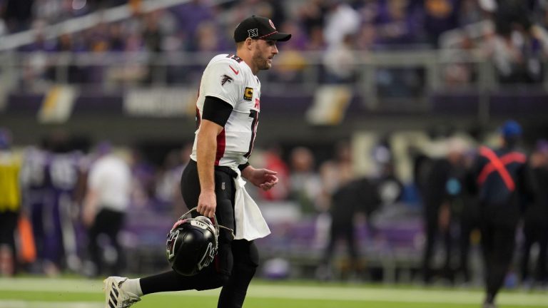 Atlanta Falcons quarterback Kirk Cousins (18) jogs off the field at halftime of an NFL football game against the Minnesota Vikings, Sunday, Dec. 8, 2024, in Minneapolis. (Abbie Parr/AP)