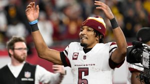 Washington Commanders quarterback Jayden Daniels (5) celebrates after an NFL wild-card playoff football game against the Tampa Bay Buccaneers in Tampa, Fla., Sunday, Jan. 12, 2025. (Jason Behnken/AP)