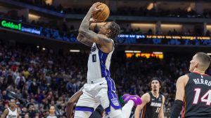 Sacramento Kings forward DeMar DeRozan, centre, makes a jump shot during double overtime of an NBA basketball game against the Miami Heat Monday, Jan. 6, 2025, in Sacramento, Calif. The Kings win 123-118 in double overtime. (Sara Nevis/AP)