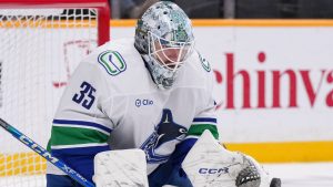 Vancouver Canucks goaltender Thatcher Demko (35) deflects a shot on goal during the second period of an NHL hockey game against the Nashville Predators, Wednesday, Jan. 29, 2025, in Nashville, Tenn. (George Walker IV/AP)