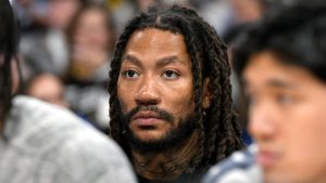 Former NBA guard Derrick Rose looks on from the bench in the second half of an NBA basketball game, Friday, March 1, 2024. (Brandon Dill/AP)