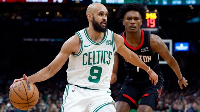 Boston Celtics' Derrick White (9) drives past Houston Rockets' Amen Thompson (1) during the second half of an NBA basketball game. (Michael Dwyer/AP)