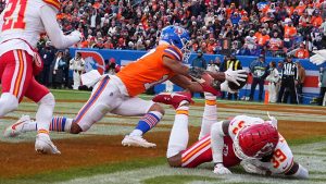 Denver Broncos wide receiver Devaughn Vele (17) catches a tipped ball for a touchdown in the 2nd quarter against the Kansas City Chiefs during an NFL football game, Sunday, Jan. 5, 2025 in Denver. (Bart Young/AP)