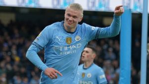 Manchester City's Erling Haaland celebrates after scoring his side's 2nd goal against West Ham during a English Premier League soccer match at Etihad stadium in Manchester, England, Saturday, Jan. 4, 2025. (AP Photo/Ian Hodgson)