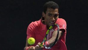 Felix Auger-Aliassime of Canada plays a backhand return to Alejandro Davidovich Fokina of Spain during their second round match at the Australian Open tennis championship in Melbourne, Australia, Wednesday, Jan. 15, 2025. (Asanka Brendon Ratnayake/AP)