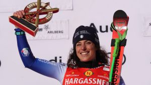 The winner Italy's Federica Brignone celebrates after completing an alpine ski, women's World Cup downhill race, in St. Anton, Austria, Saturday, Jan. 11, 2025. (AP Photo/Giovanni Auletta)