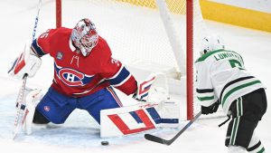 Dallas Stars' Nils Lundkvist (5) moves in on Montreal Canadiens goaltender Sam Montembeault during first period NHL hockey action in Montreal, Saturday, January 11, 2025. (Graham Hughes/CP)