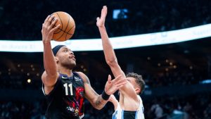 Toronto Raptors forward Bruce Brown (11) drives to the net as Orlando Magic forward Tristan da Silva (23) defends during the first half of NBA basketball action in Toronto on Tuesday, January 21, 2025. (Thomas Skrlj/CP)