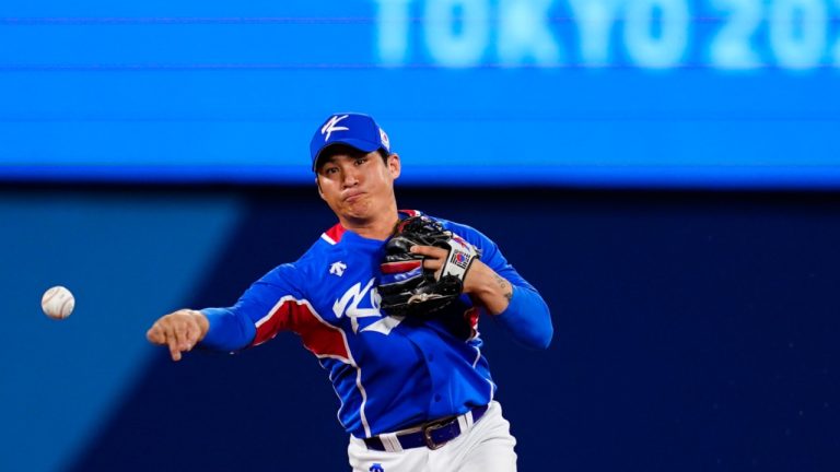 South Korea's Hyeseong Kim throws to first after forcing out Japan's Yuki Yanagita during a semi-final baseball game at the 2020 Summer Olympics, Wednesday, Aug. 4, 2021, in Yokohama, Japan. (AP Photo/Matt Slocum)