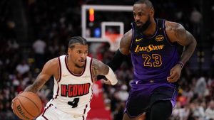 Los Angeles Lakers forward LeBron James (23) defends against Houston Rockets guard Jalen Green (4) during the second half of an NBA basketball game. (Ashley Landis/AP)