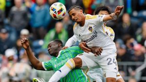 Los Angeles Galaxy defender Jalen Neal (24) wins a header over Seattle Sounders FC defender Yeimar Gómez, left, during the first half of an MLS game Sunday, May 5, 2024, in Seattle. (Jennifer Buchanan/The Seattle Times via AP)